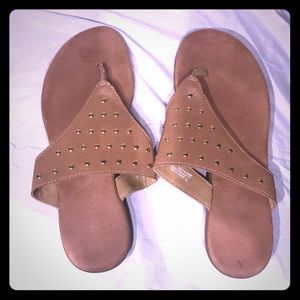 Tan and gold flip flop sandals